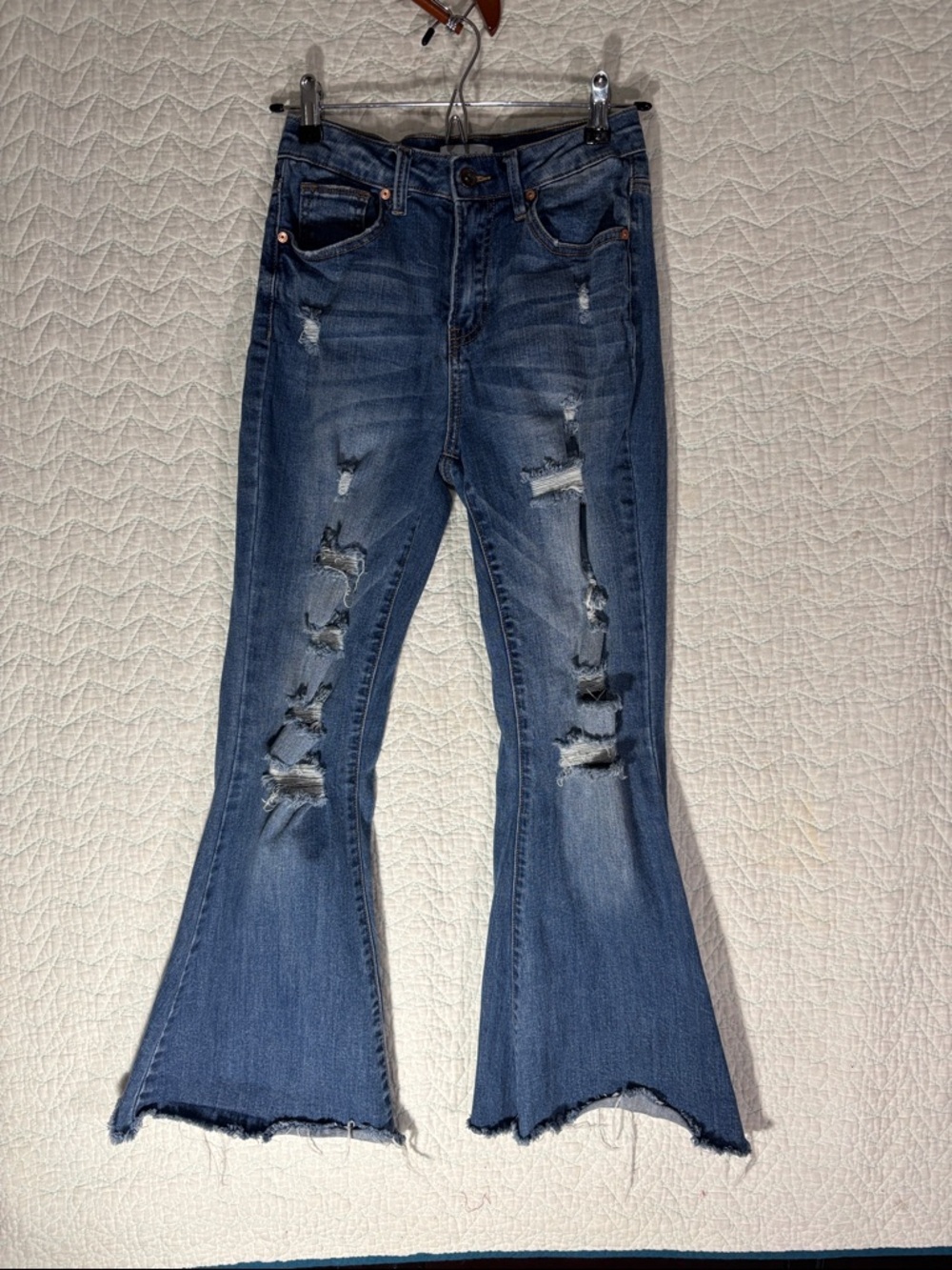 Distressed Blue Flare Jeans with Raw Hem High Rise
